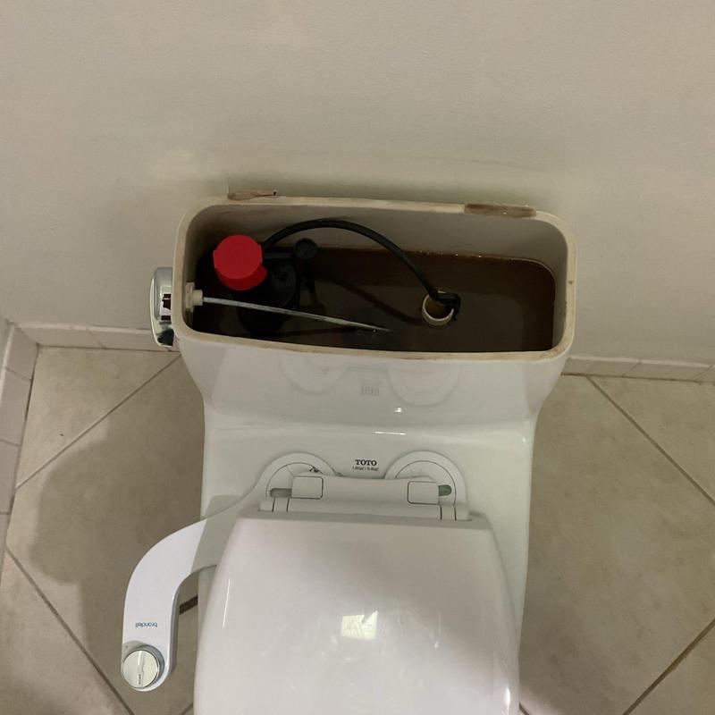 Toilet tank with internal valve and float assembly