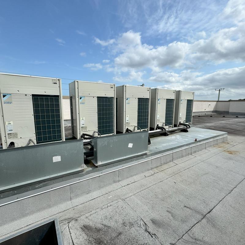VRF outdoor units on commercial school rooftop VRF outdoor units on commercial school rooftop
