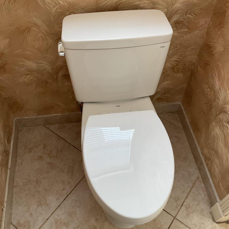 Toto toilet installed in bathroom corner