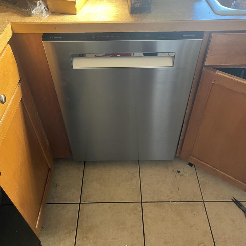 Dishwasher installation with plumbing and electrical work
