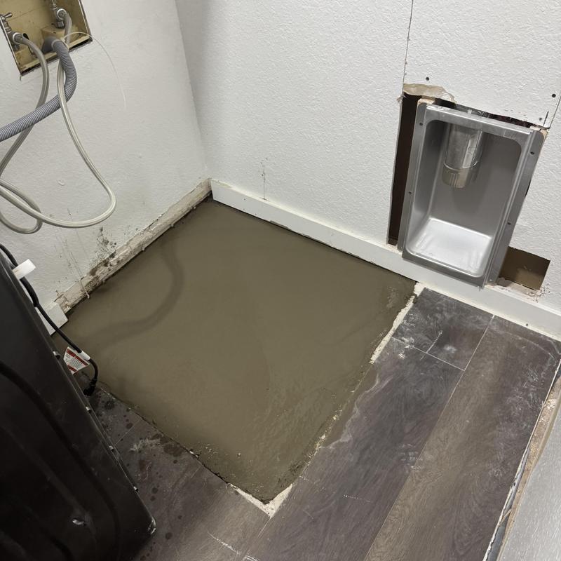 Dryer vent and concrete base installation in laundry area