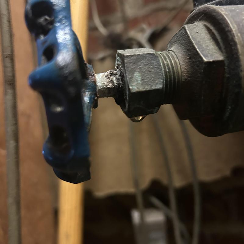 Leaky shut off valve on commercial pipe with drip Leaky shut off valve on commercial pipe with drip