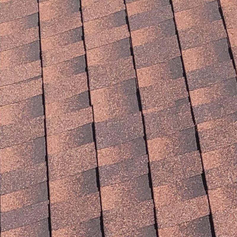 Hip cap shingles with granule loss on roof surface