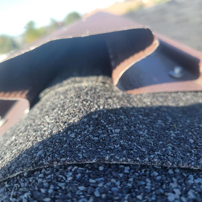 Roof ridge cap close-up showing shingle condition Cape Coral