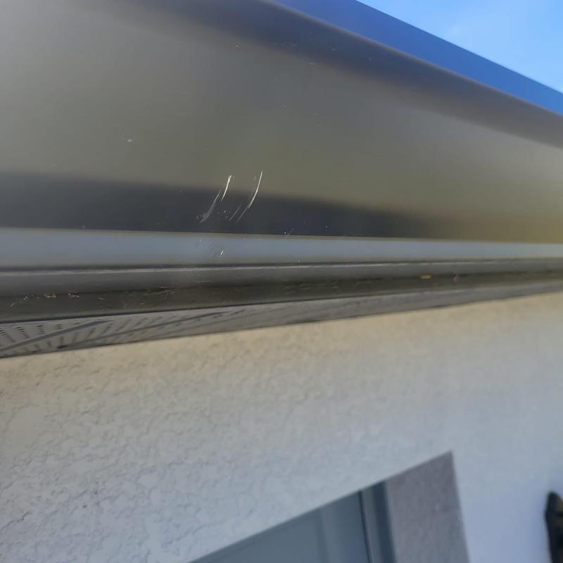 Gutter close-up showing minor scratches Cape Coral FL
