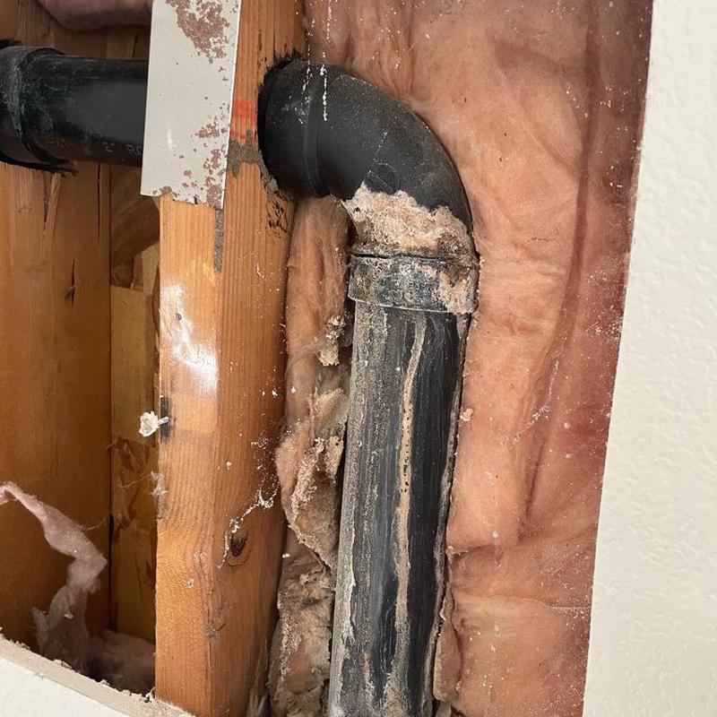 2-inch ABS drain pipe with cracked elbow joint