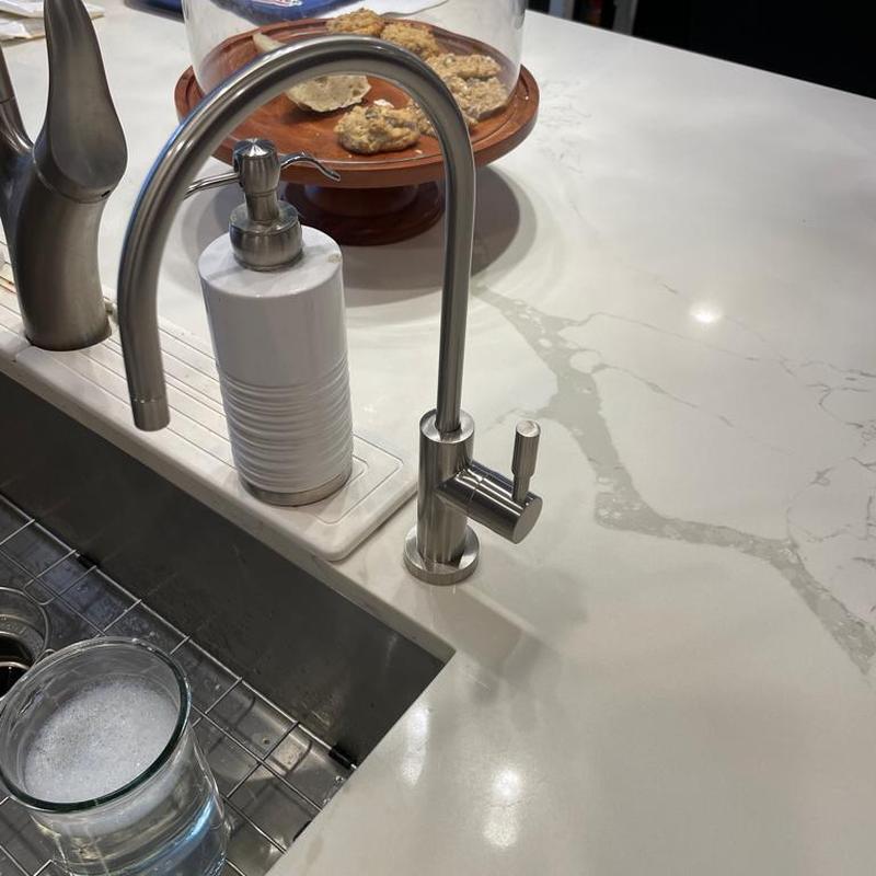 Reverse osmosis faucet installed on kitchen sink countertop