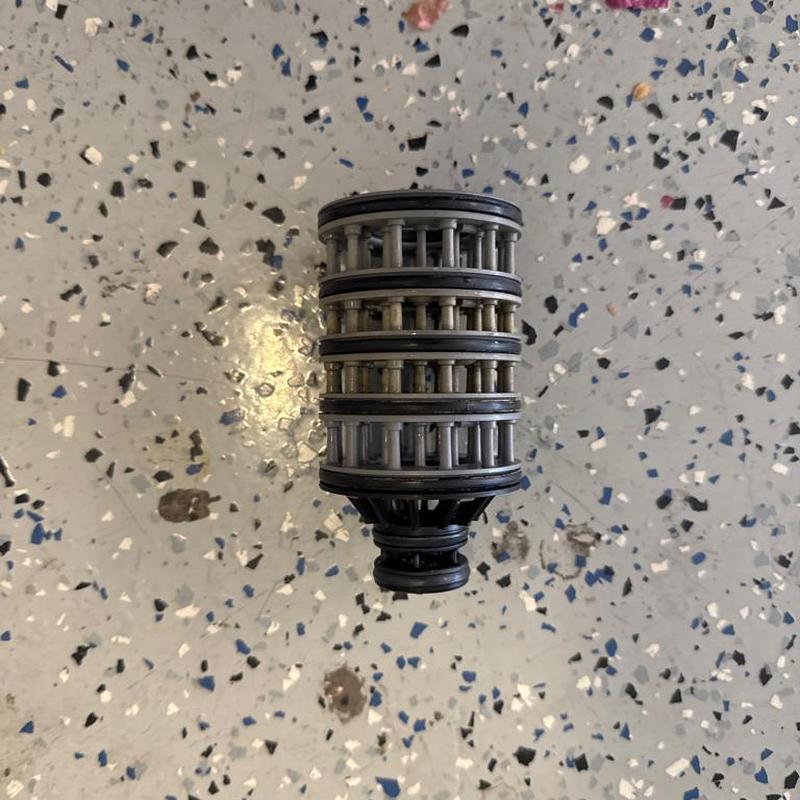 Water softener seal stack kit on speckled floor