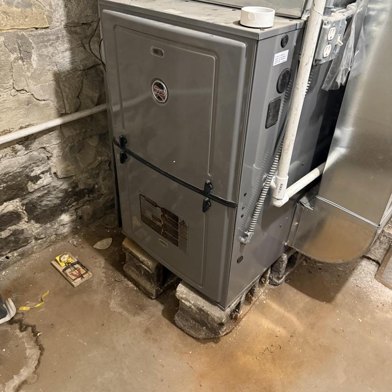 Furnace system in basement with concrete block supports