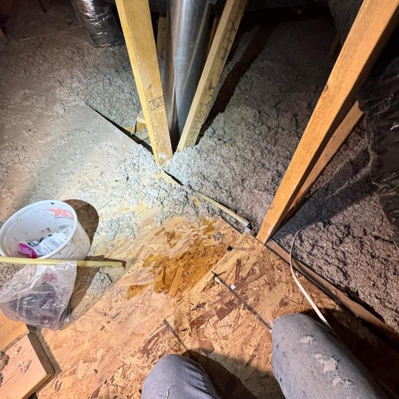 PEX tubing loop and pressure regulator valve installation in attic