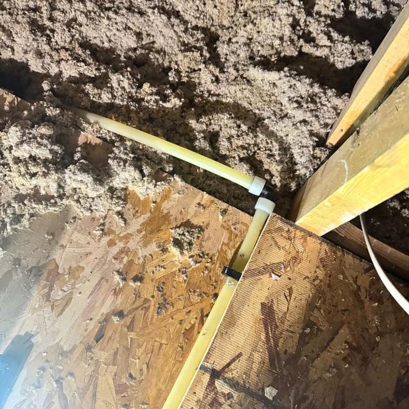 PEX piping loop and secured lines in attic