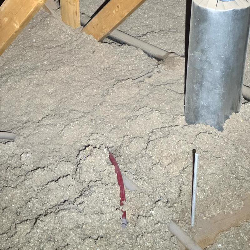 PEX piping loop and copper riser with pressure valve in attic