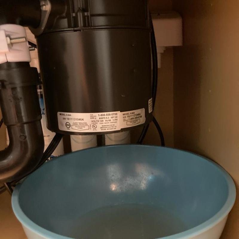 Garbage disposal under sink with water basin