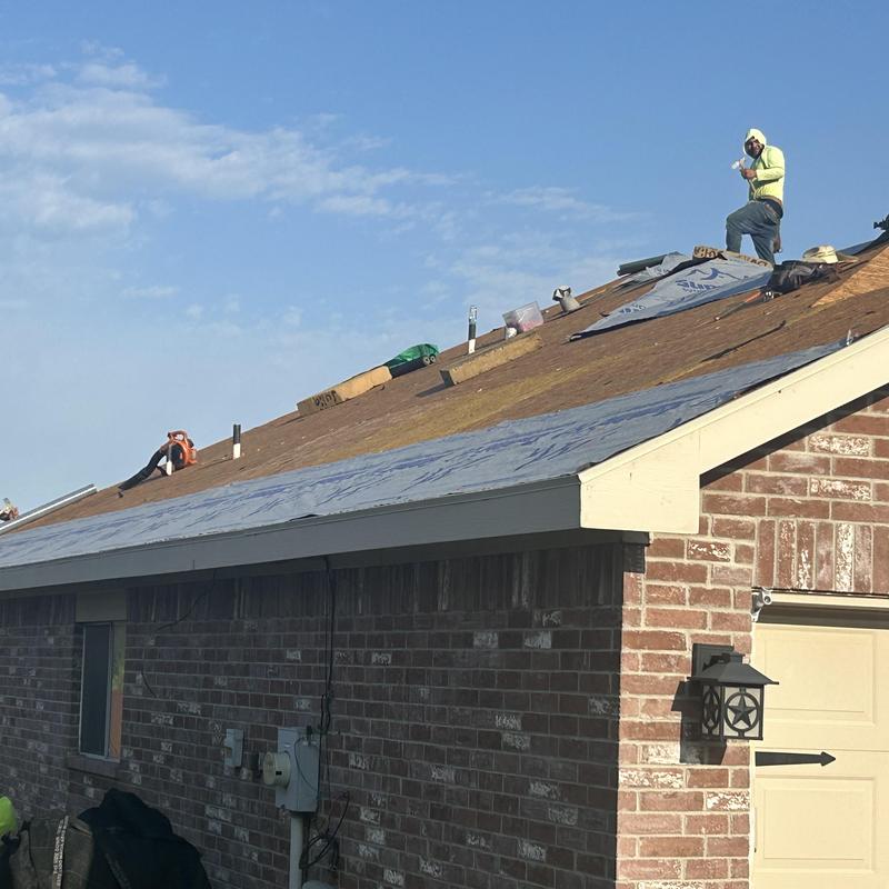 Roof decking removal on residential brick home