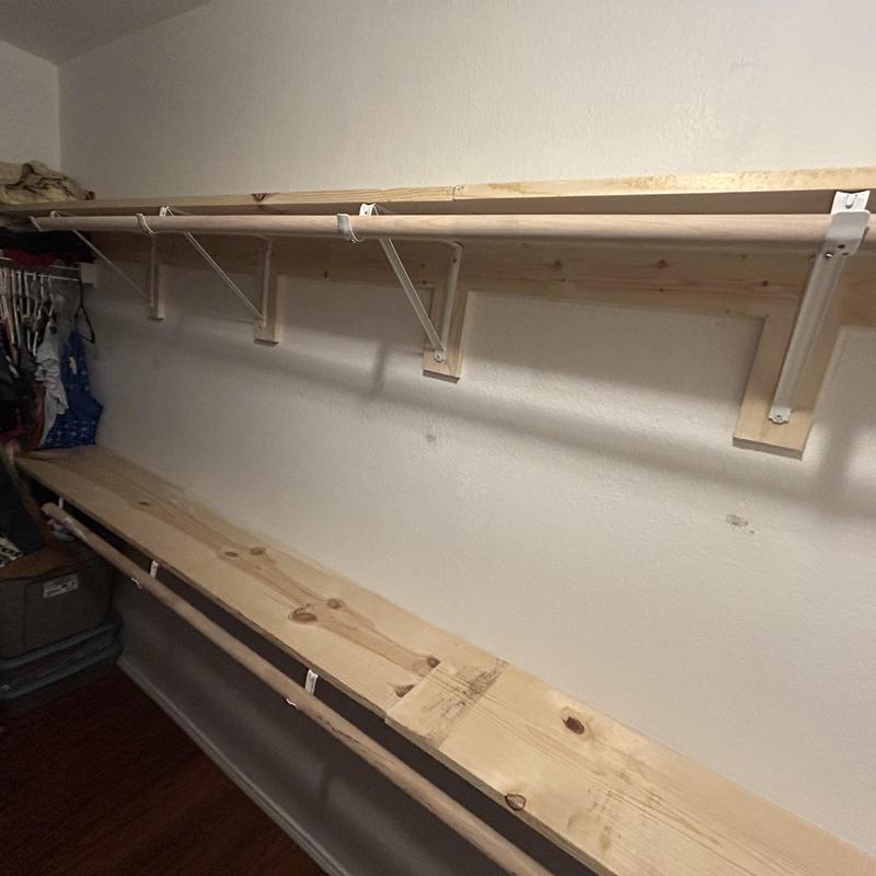 Custom wood closet shelving with hanging rods