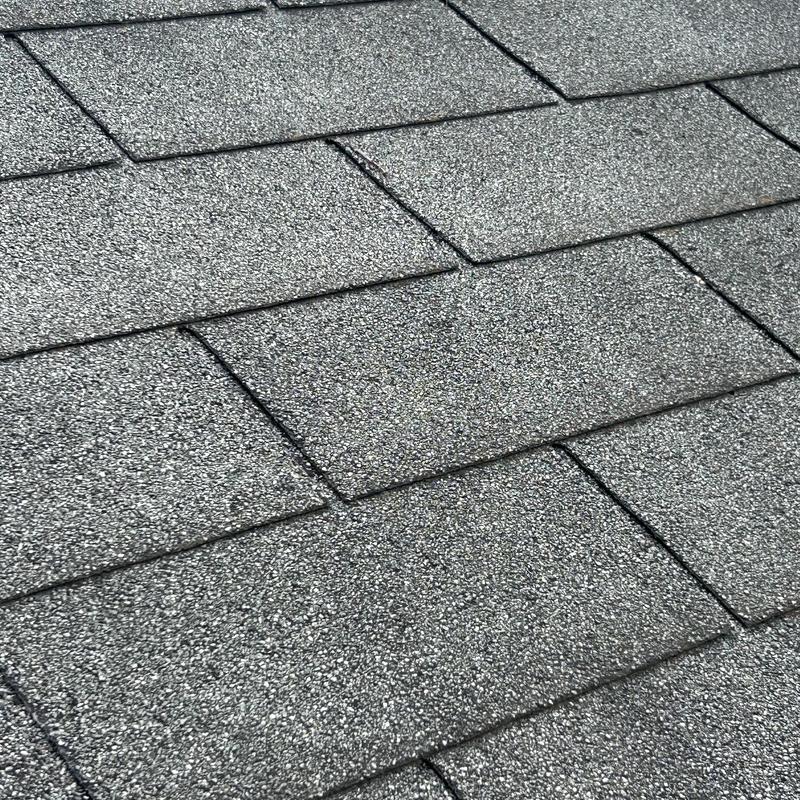Asphalt shingle roof close-up showing granule texture