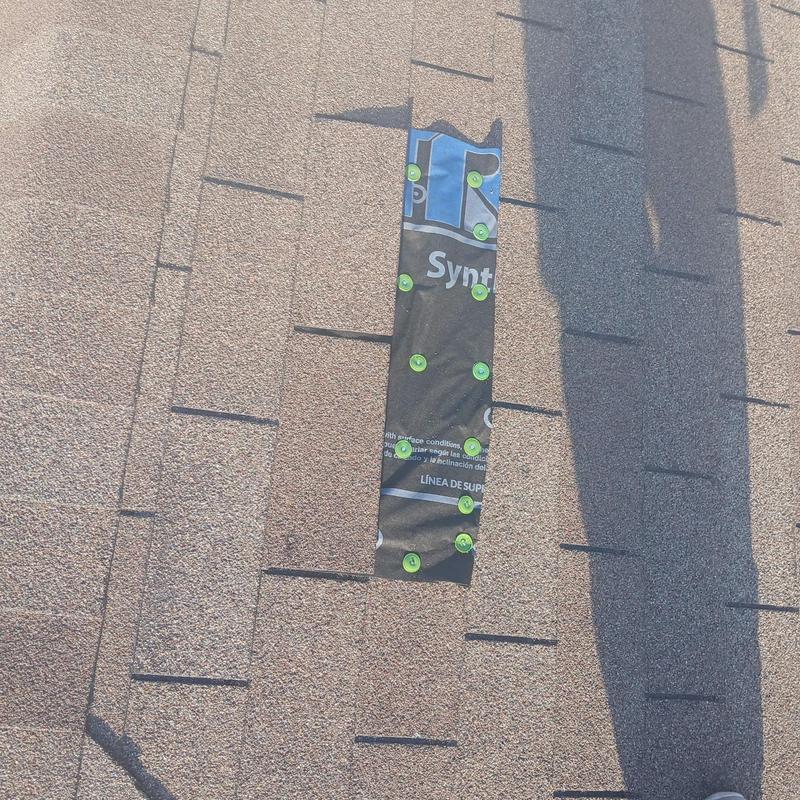 Synthetic roofing underlayment nailed over missing shingles