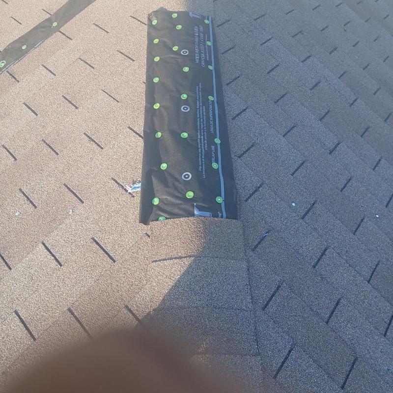 Synthetic roofing paper installation over missing shingles