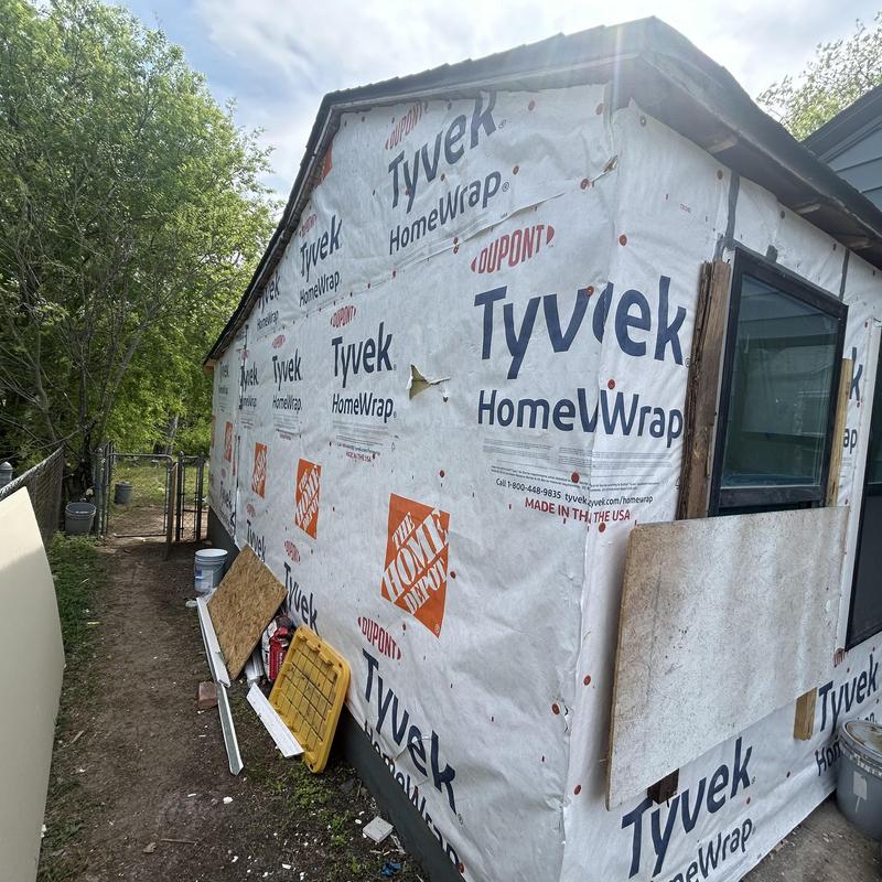 Tyvek HomeWrap siding underlayment on house corner