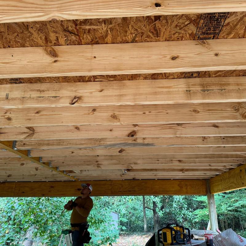 Roof framing with raised garage ceiling structure