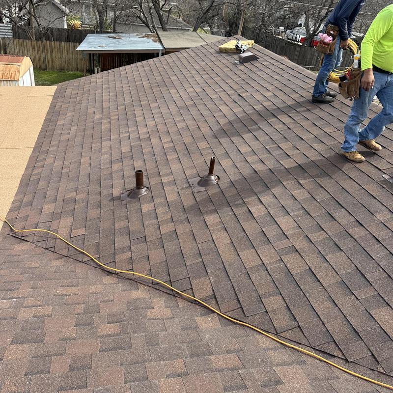 Brown wood Owens Corning architectural roof shingles installation