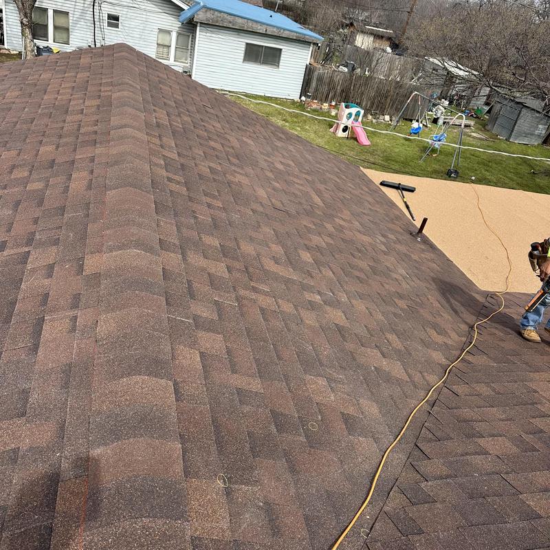 Brown wood Owens Corning architectural shingle roof installation