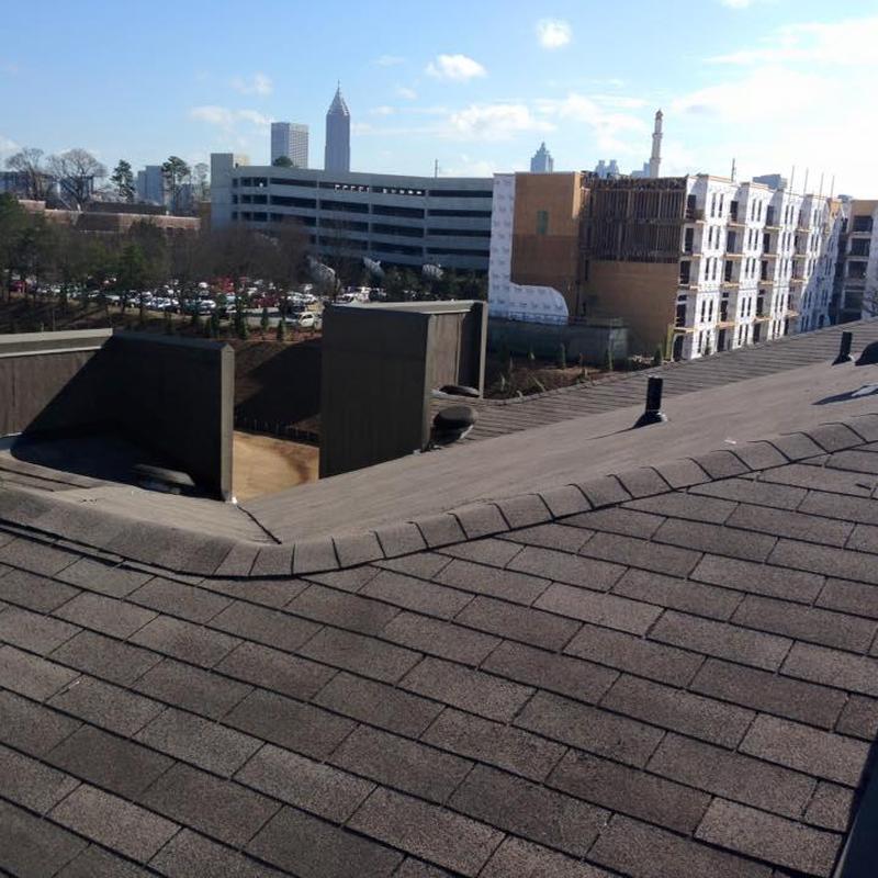 Asphalt shingle roof on highrise apartment building
