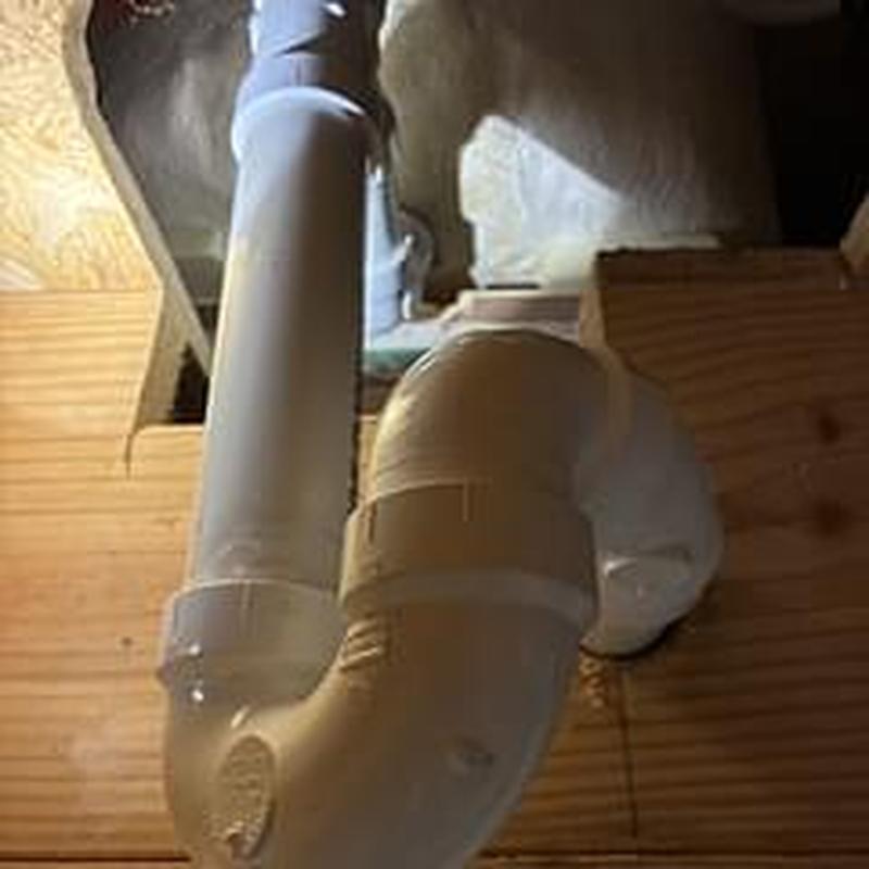 Bathtub P-trap and waste pipe installation under floor