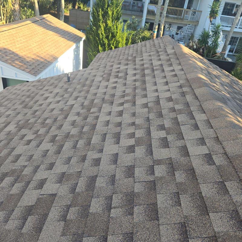 Asphalt shingle roof with new ridge cap shingles