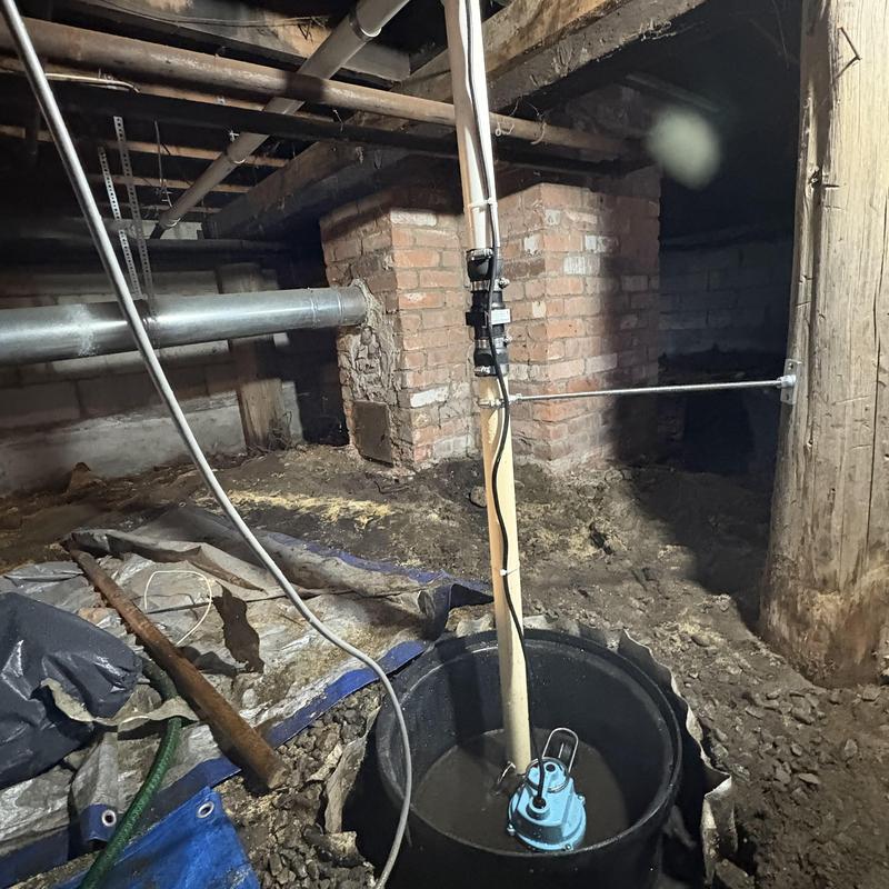 Composite sump pit with 1/3 hp pump and PVC piping installation Composite sump pit with 1/3 hp pump and PVC piping installation