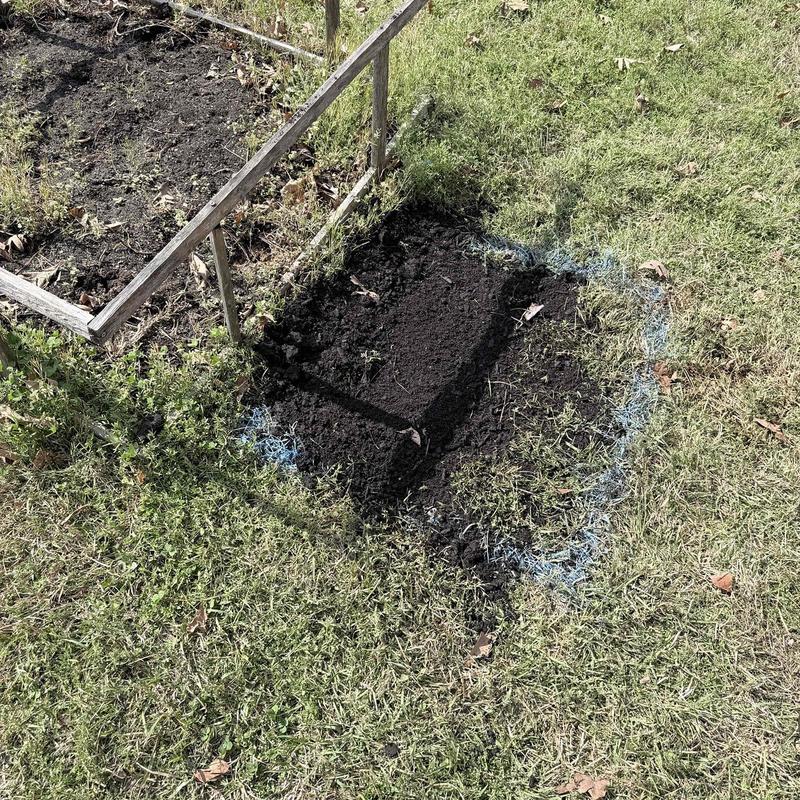 Underground water line excavation with marked repair area