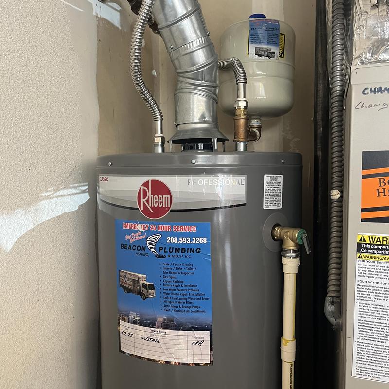 Water heater with plumbing inspection and service label Water heater with plumbing inspection and service label