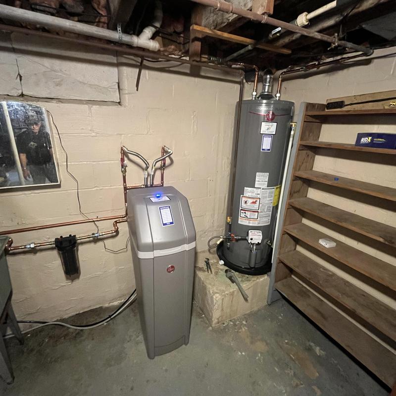 Water softener and water heater installed in basement