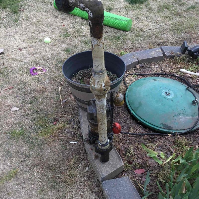Sewer pump system with discharge piping outdoors