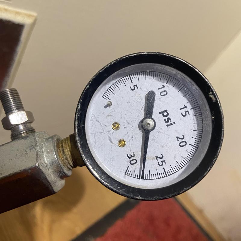 Gas pressure gauge showing pressure reading at 12 psi