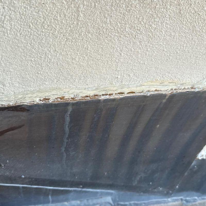 Roof flashing with rust and sealant deterioration