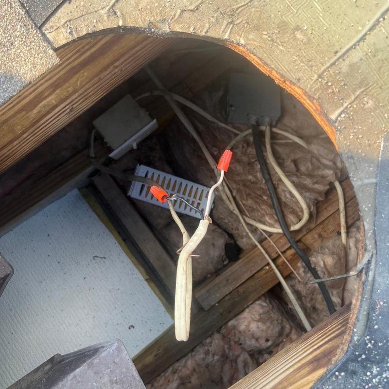 Electrical wiring splice in attic with wire nuts installed