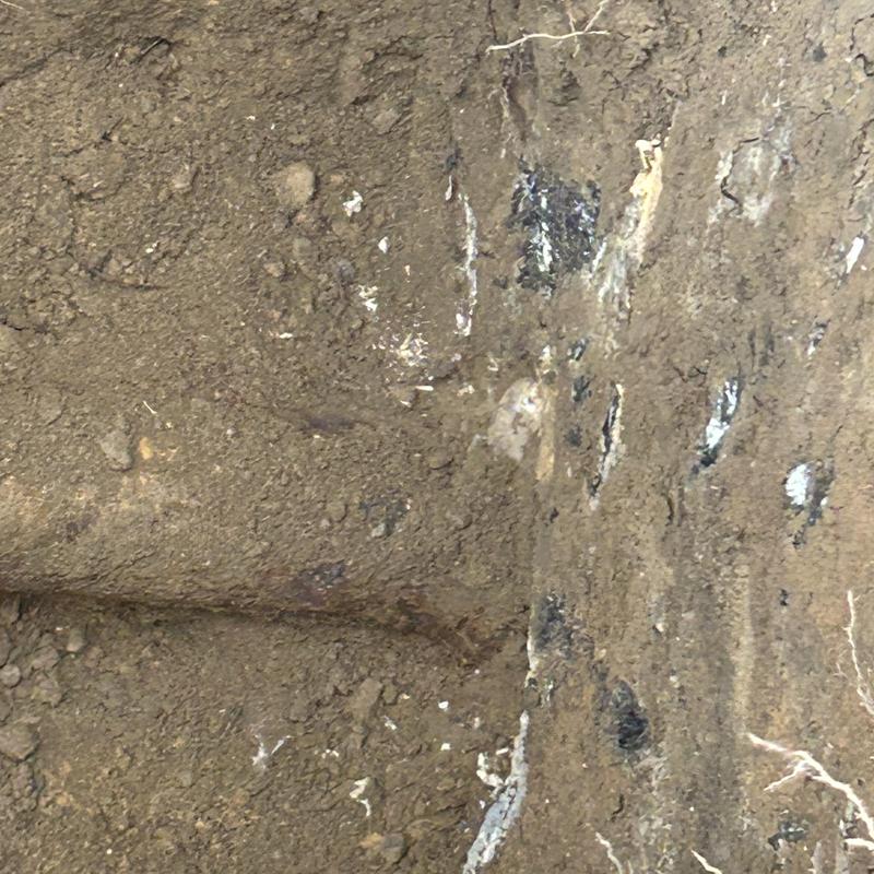 Broken sewer pipe in soil excavation site Broken sewer pipe in soil excavation site