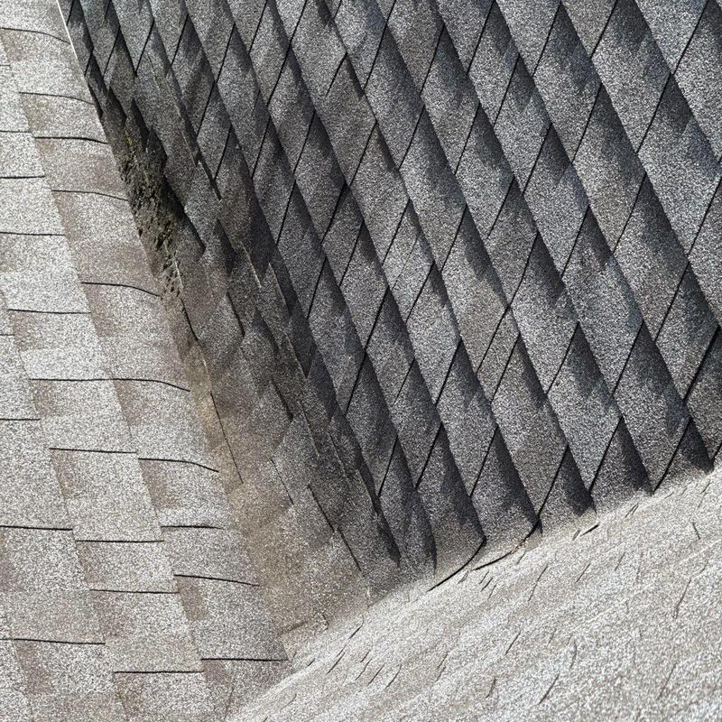 Architectural shingles with hail and age damage