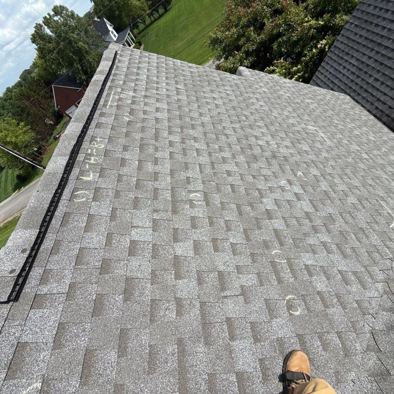 Architectural shingles roof with hail damage markings