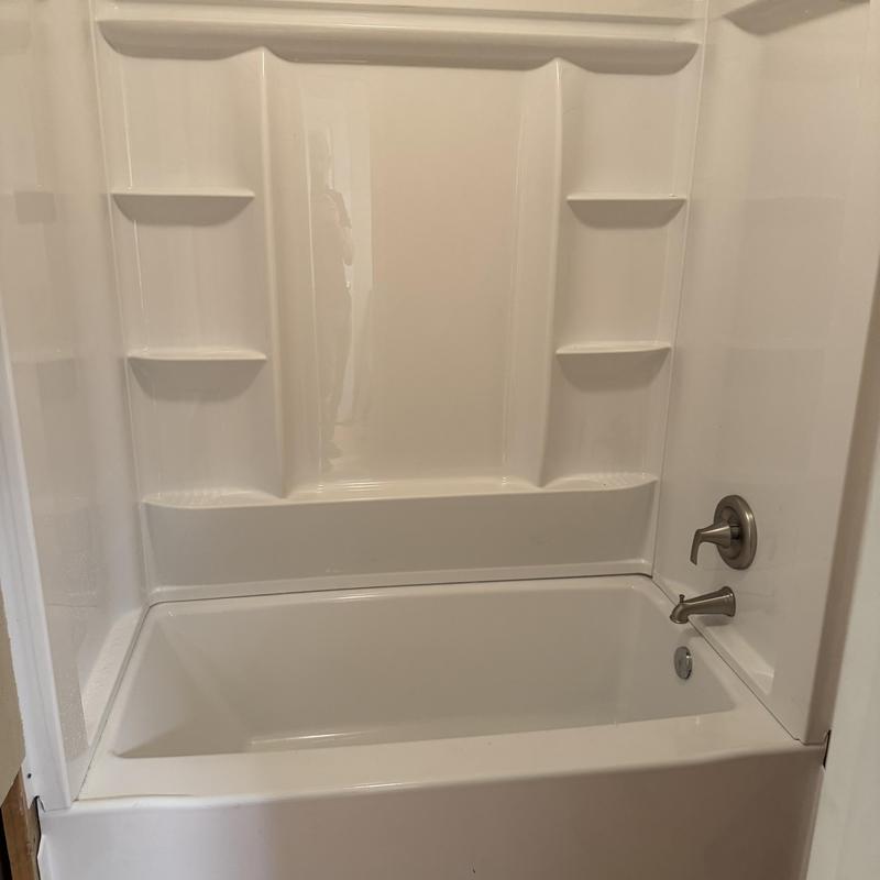 Delta tub surround with Moen shower faucet and tub diverter Delta tub surround with Moen shower faucet and tub diverter