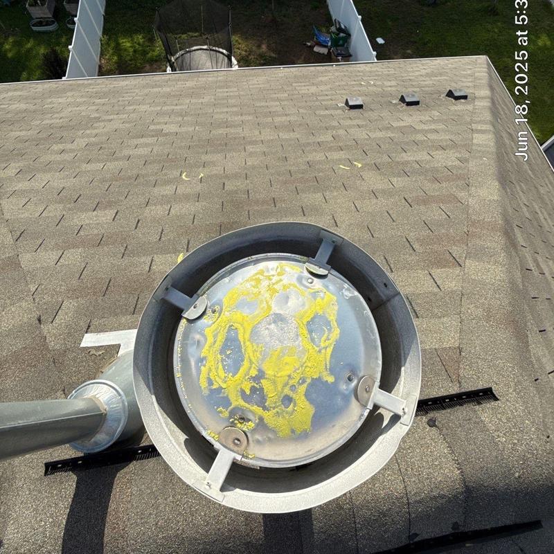 Roof vent cap with corrosion and roof shingles background