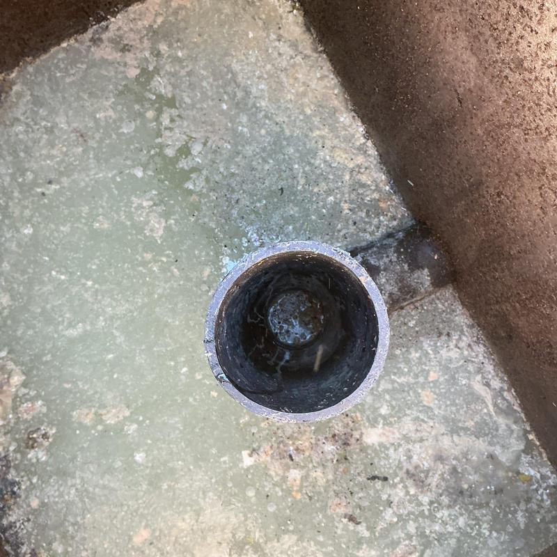 Grease trap inlet pipe with buildup inside tank Grease trap inlet pipe with buildup inside tank