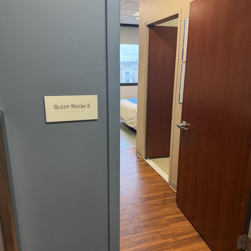 Sleep room entrance with wooden door and hardwood floor Sleep room entrance with wooden door and hardwood floor