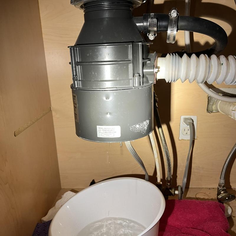 Garbage disposal under sink leaking water drip
