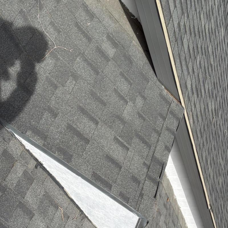 Asphalt shingle roof with valley flashing detail