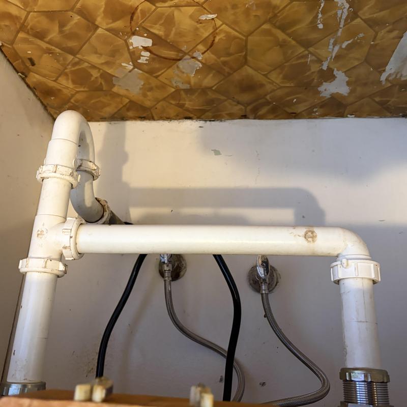 Kitchen sink PVC drain and water supply pipes installation Kitchen sink PVC drain and water supply pipes installation