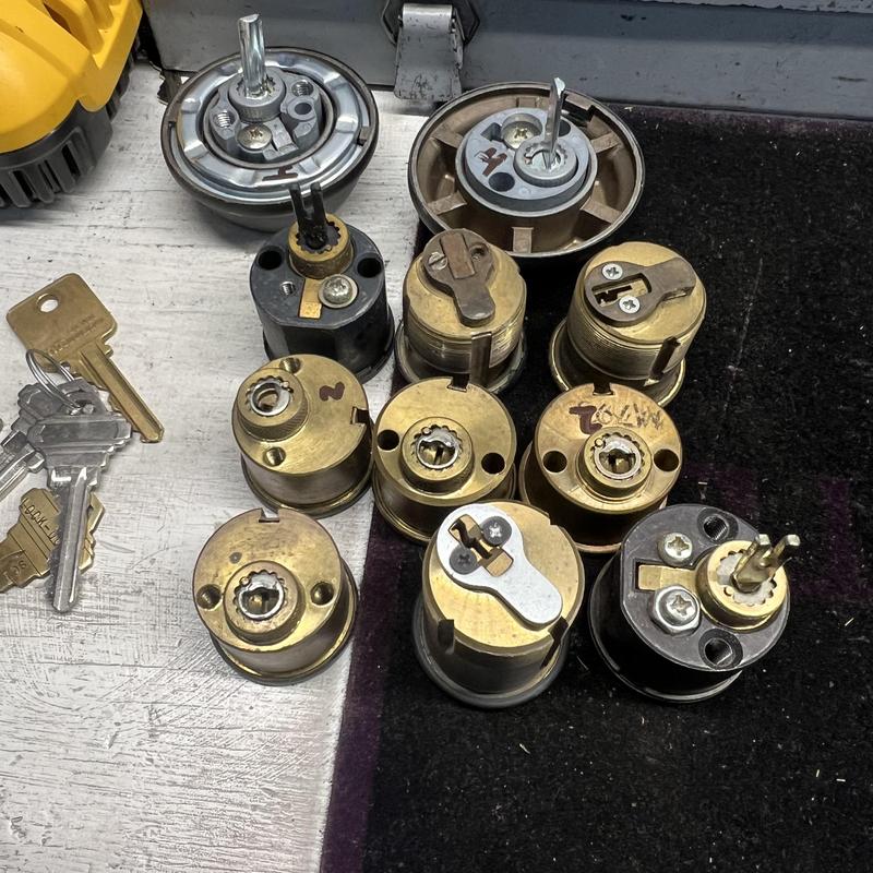 House lock cylinders and new keys on workbench