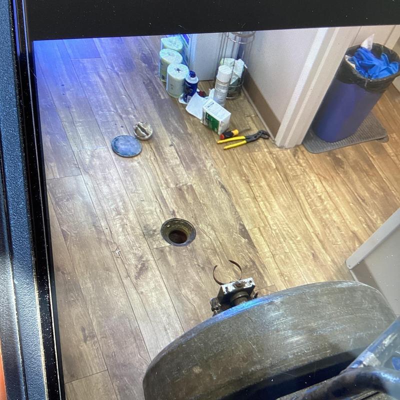 Toilet flange mainline with clog and plumbing tools