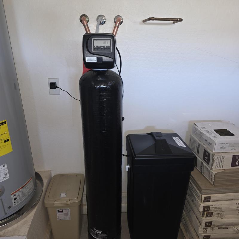 Water softener system installed in utility room